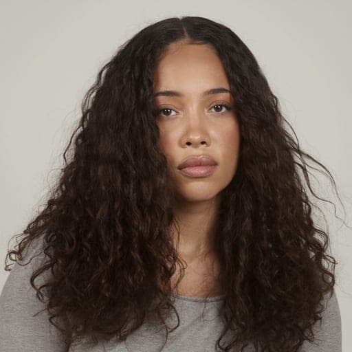 A woman with long layered hair